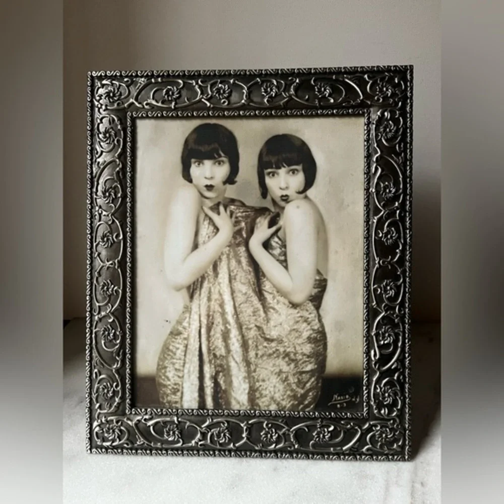 Large ornate silver Frame for photo 8”x10” free standing..